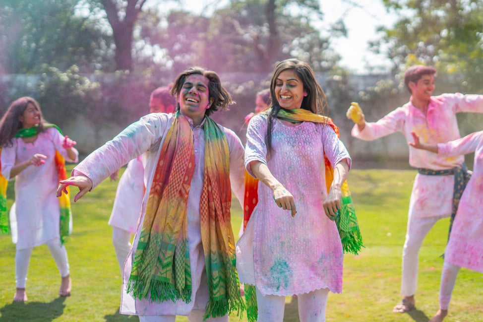 Indian couple playing Holi